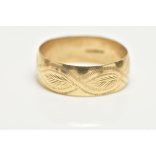 33 - A 9CT GOLD BAND RING, a yellow gold wide band with an engraved foliage pattern detail, approximate b... 