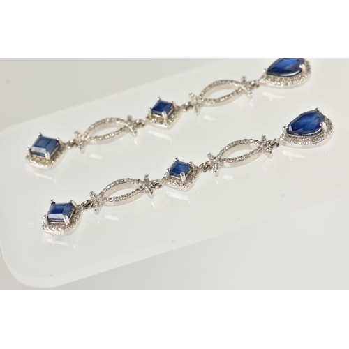 34 - A PAIR OF DIAMOND AND SAPPHIRE DROP EARRINGS, long drops set with two square cut mid blue sapphires ... 