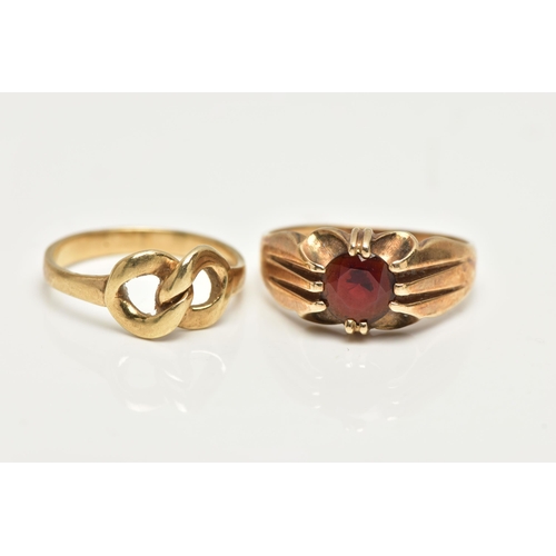 50 - TWO 9CT GOLD RINGS, the first designed with a claw set, circular cut garnet to a polished band, hall... 