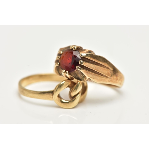 50 - TWO 9CT GOLD RINGS, the first designed with a claw set, circular cut garnet to a polished band, hall... 