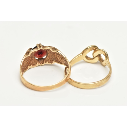 50 - TWO 9CT GOLD RINGS, the first designed with a claw set, circular cut garnet to a polished band, hall... 