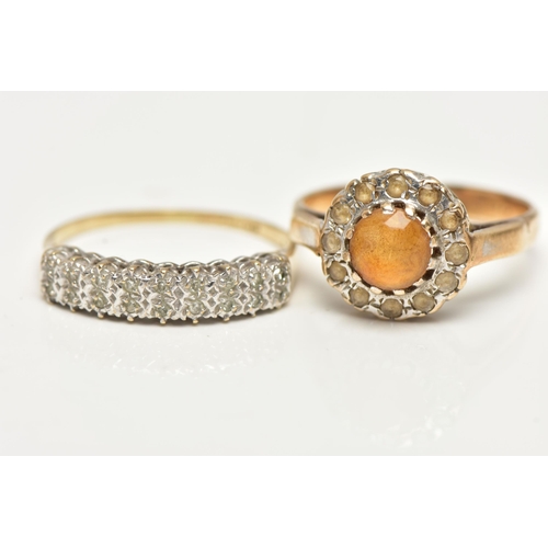 52 - TWO GEM SET RINGS, the first a cluster ring set with a central, circular cut orange stone in a surro... 