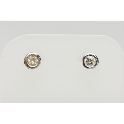 59 - A PAIR OF DIAMOND STUD EARRINGS, each collet set with a round brilliant cut diamond, each approximat... 