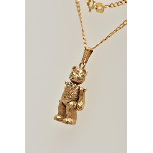 6 - A 9CT GOLD ARTICULATED TEDDY BEAR PENDANT AND CHAIN, realistically textured, articulated teddy bear ... 