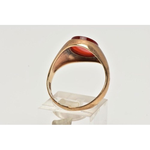 63 - A 9CT GOLD SIGNET RING, an oval cut carnelian set within a yellow gold mount, hallmarked 9ct Birming... 