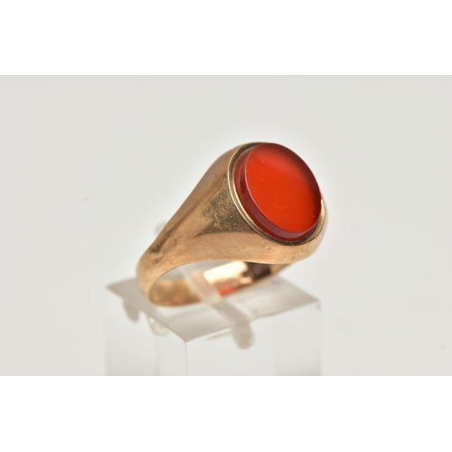 63 - A 9CT GOLD SIGNET RING, an oval cut carnelian set within a yellow gold mount, hallmarked 9ct Birming... 