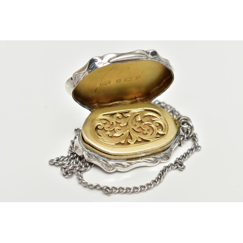 66 - A SILVER VINAIGERETTE PENDANT, lozenge form with scalloped edges, engraved with foliage detail to th... 