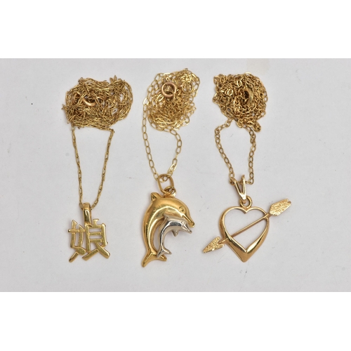 8 - THREE PENDANTS AND CHAINS, the first a double puffy dolphin pendant, fitted with an oval bail stampe... 