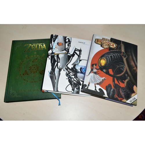 287 - THREE GAMING BOOKS, STICKERS AND POSTCARDS, includes the Portal 2 Collector's Reading Guide, The Art... 