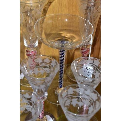 346 - A COLLECTION OF 20TH CENTURY DRINKING GLASSES WITH COLOURED GLASS STEMS, comprising a set of five wi... 