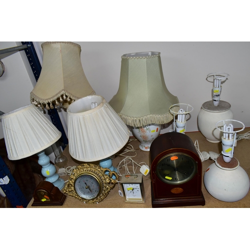 352 - GROUP OF TABLE LAMPS AND MANTEL CLOCKS, comprising three repainted cream table lamps, a mahogany man... 