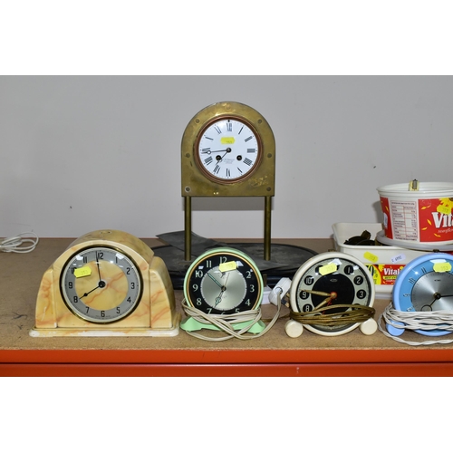 353 - A COLLECTION OF MID - CENTURY CLOCKS, comprising an Art Deco style arched mirrored electric clock ma... 