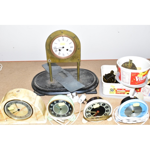 353 - A COLLECTION OF MID - CENTURY CLOCKS, comprising an Art Deco style arched mirrored electric clock ma... 