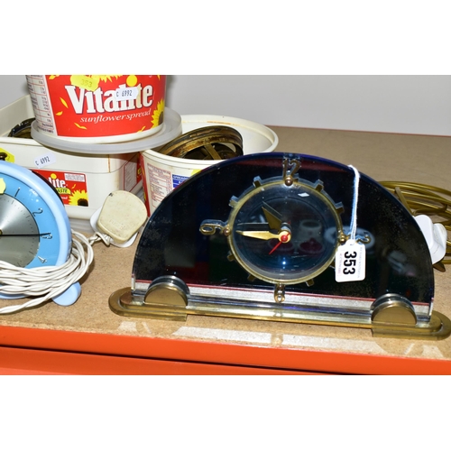 353 - A COLLECTION OF MID - CENTURY CLOCKS, comprising an Art Deco style arched mirrored electric clock ma... 