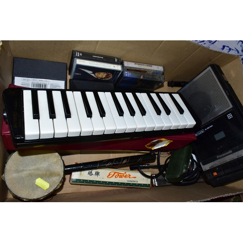 362 - THREE BOXES OF BOOKS, FRAMED PRINTS AND CDS, to include a Hohner Melodia piano 27, a Hohner Echo har... 