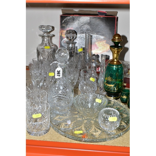 367 - A GROUP OF CUT CRYSTAL AND COLOURED GLASS, comprising three cut crystal decanters, oil decanter, six... 