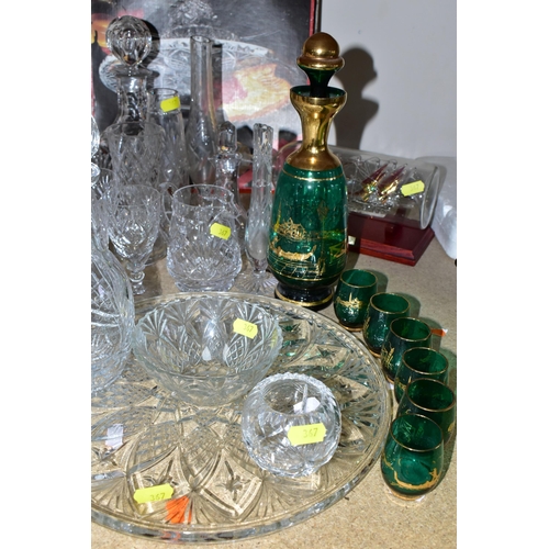 367 - A GROUP OF CUT CRYSTAL AND COLOURED GLASS, comprising three cut crystal decanters, oil decanter, six... 