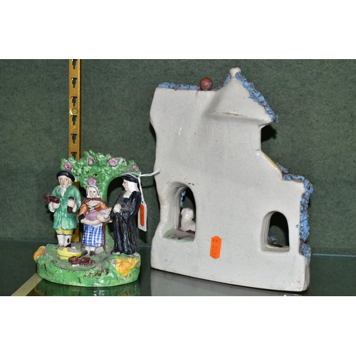 382 - TWO PIECES OF VICTORIAN STAFFORDSHIRE POTTERY, comprising an unusual thatched cottage with recumbent... 