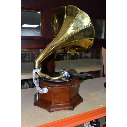 422 - A REPRODUCTION GRAMOPHONE, with horn and wooden base, does wind and turntable revolves (1) (Conditio... 