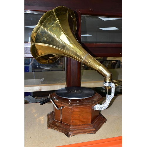 422 - A REPRODUCTION GRAMOPHONE, with horn and wooden base, does wind and turntable revolves (1) (Conditio... 