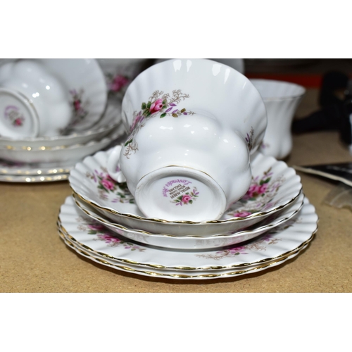 463 - A TWENTY ONE PIECE ROYAL ALBERT LAVENDER ROSE TEA SET, comprising a cake plate, a cream jug, a sugar... 