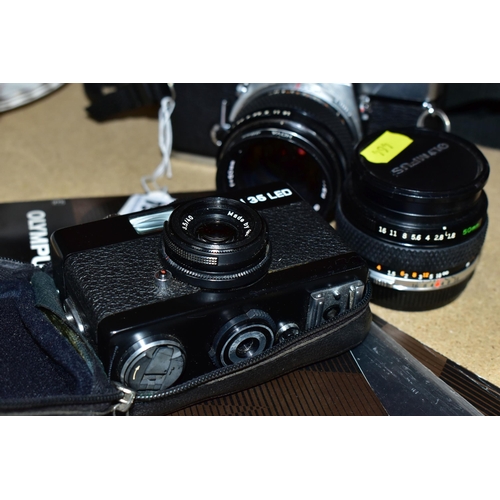 464 - AN OLYMPUS OM-1N FILM SLR CAMERA  with manual fitted with a Zuiko Auto-S 50mm f1.4 lens, an Auto-S 5... 