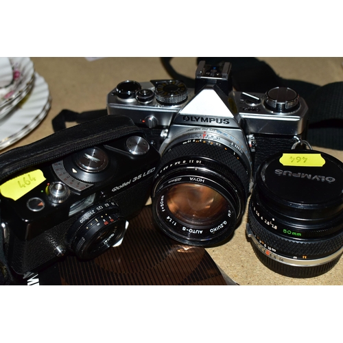 464 - AN OLYMPUS OM-1N FILM SLR CAMERA  with manual fitted with a Zuiko Auto-S 50mm f1.4 lens, an Auto-S 5... 