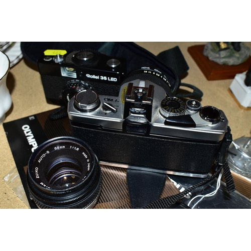 464 - AN OLYMPUS OM-1N FILM SLR CAMERA  with manual fitted with a Zuiko Auto-S 50mm f1.4 lens, an Auto-S 5... 