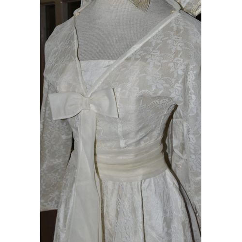 483 - A VINTAGE WEDDING DRESS AND A SILK CHRISTENING GOWN, comprising a handmade cream silk christening go... 