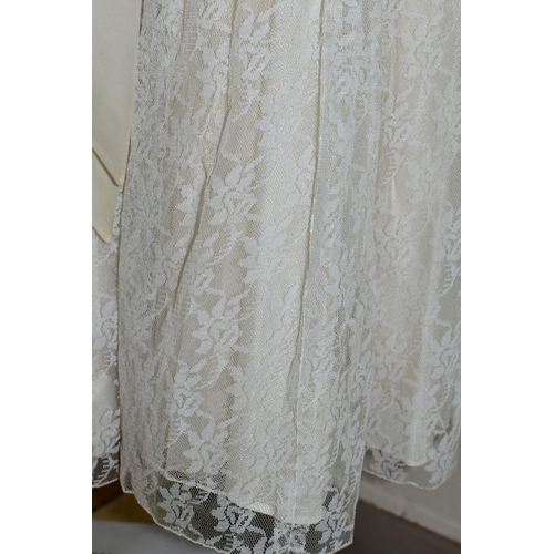 483 - A VINTAGE WEDDING DRESS AND A SILK CHRISTENING GOWN, comprising a handmade cream silk christening go... 