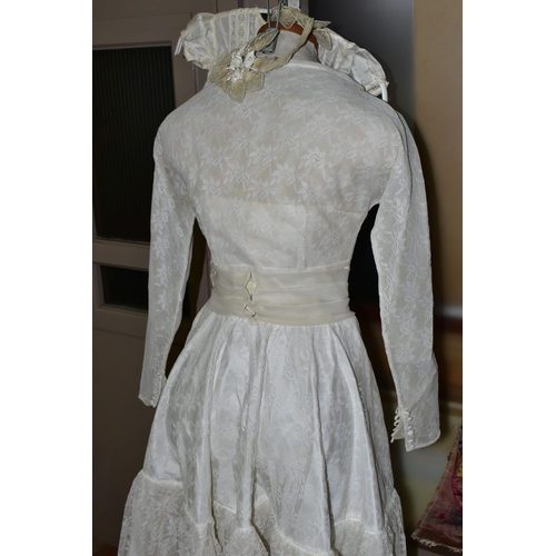 483 - A VINTAGE WEDDING DRESS AND A SILK CHRISTENING GOWN, comprising a handmade cream silk christening go... 