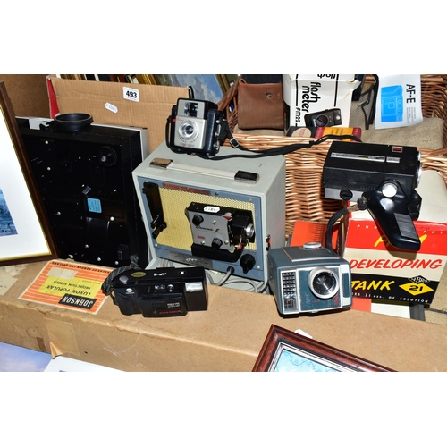 493 - ONE BOX OF FRAMED PRINTS, VINTAGE MOVIE CAMERAS AND PROJECTORS, to include a large gilt framed water... 