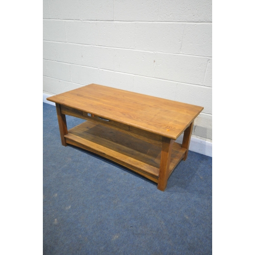 1199 - A GOLDEN OAK COFFEE TABLE, with a single drawer to each side, with undershelf, length 117cm x depth ... 