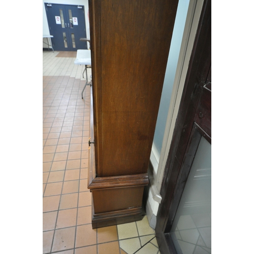 1329 - A LARGE LATE 19TH CENTURY MAHOGANY DISPLAY CABINET, overhanging cornice, fitted with two glazed door... 