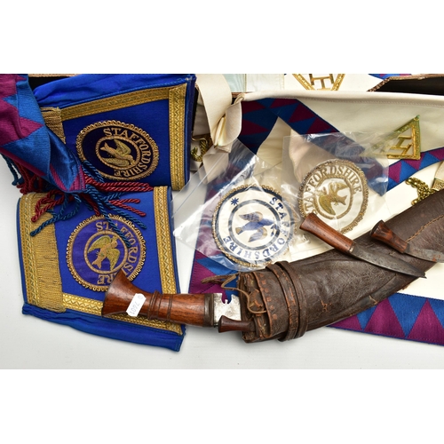 119 - A BOX OF MASONIC REGALIA AND A DAGGER, to include Masonic sashes, a pair of blue and gold detailed g... 