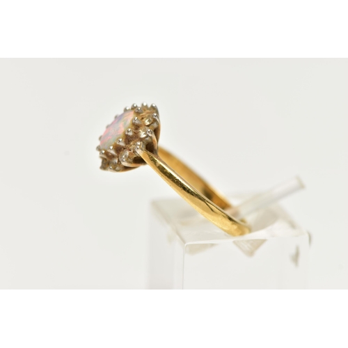 40 - A 18CT GOLD OPAL CLUSTER RING, a single cabochon set with a surround of round brilliant cut diamonds... 