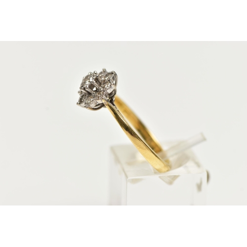 51 - A MODERN DIAMOND CLUSTER RING, set with a principal round brilliant cut diamond, surrounded by eight... 