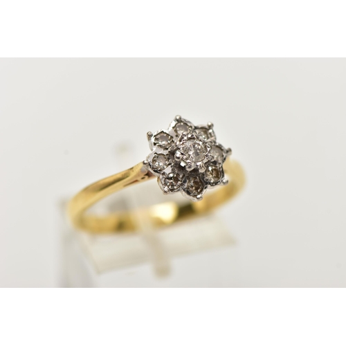 51 - A MODERN DIAMOND CLUSTER RING, set with a principal round brilliant cut diamond, surrounded by eight... 