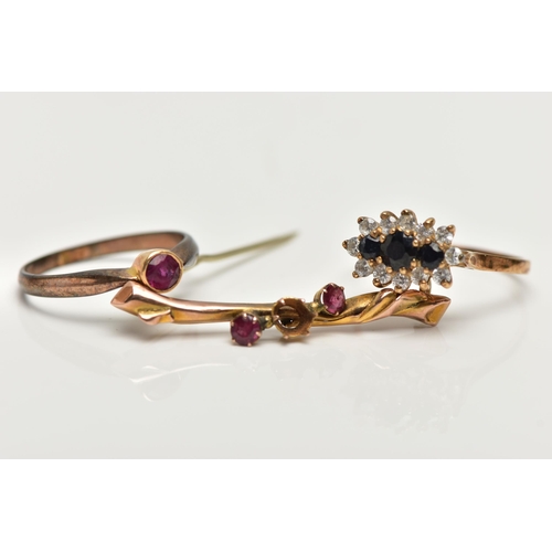 82 - TWO RINGS AND A BROOCH, the first a cluster ring set with three graduated circular cut blue sapphire... 