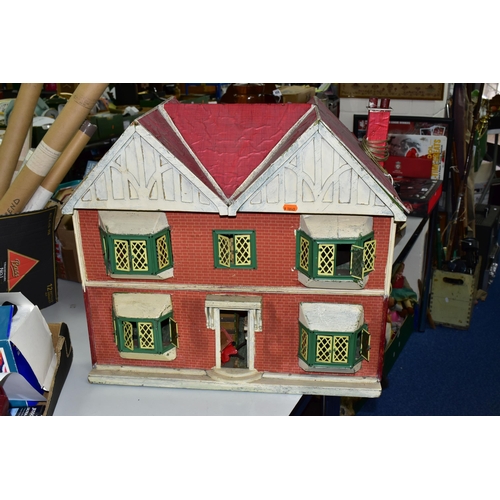 A CIRCA 1950'S DOLLS HOUSE, POSSIBLY BY TRIANG, converted
