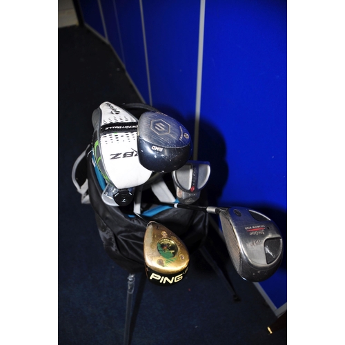 1054 - GOLF EQUIPMENT comprising a Ram golf bag containing seven golf clubs, Odyssey white hot putter, Zebr... 