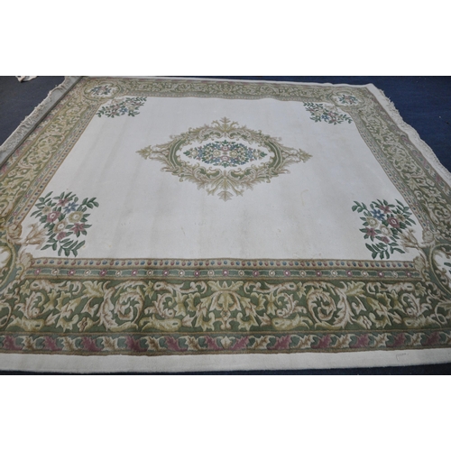 1326 - A X LARGE ORIENTAL WOLLEN RUG, cream and green ground, with a central medallion, 456cm x 368cm (cond... 