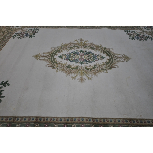 1326 - A X LARGE ORIENTAL WOLLEN RUG, cream and green ground, with a central medallion, 456cm x 368cm (cond... 