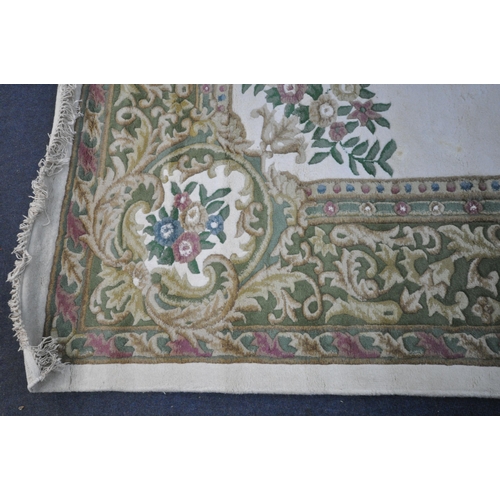 1326 - A X LARGE ORIENTAL WOLLEN RUG, cream and green ground, with a central medallion, 456cm x 368cm (cond... 