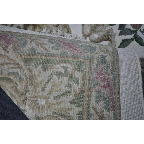 1326 - A X LARGE ORIENTAL WOLLEN RUG, cream and green ground, with a central medallion, 456cm x 368cm (cond... 