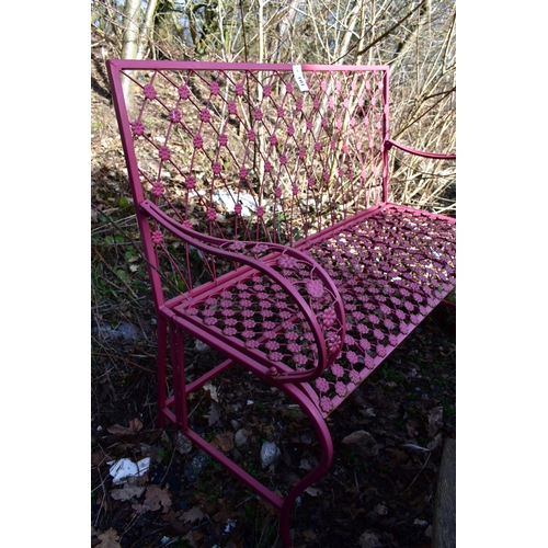 901 - A PINK PAINTED WROUGHT IRON GARDEN BENCH, with floral decoration, length 114cm (condition:-slightly ... 