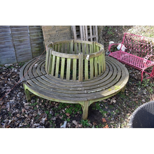 902 - A WEATHERED TEAK TREE BENCH, overall diameter 220cm x inner diameter 100cm (condition:- losses to be... 