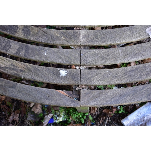 902 - A WEATHERED TEAK TREE BENCH, overall diameter 220cm x inner diameter 100cm (condition:- losses to be... 