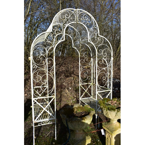 904 - AN ARCHICTURAL WROUGHT IRON GARDEN ROSE ARBOUR, with a seat at each end, width 170cm x depth 93cm x ... 