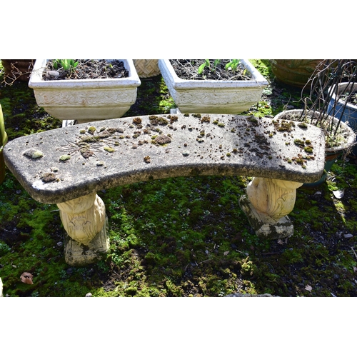 914 - A WEATHERED COMPOSITE CURVED BENCH, on a pair of squirrel shaped bases, length 115cm (condition:-no ... 